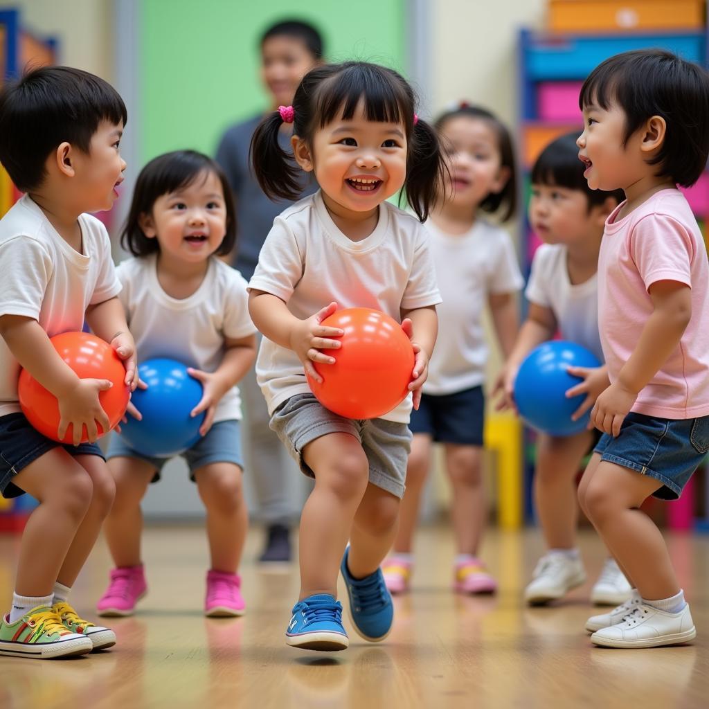 Trẻ mầm non chơi trò kẹp bóng.